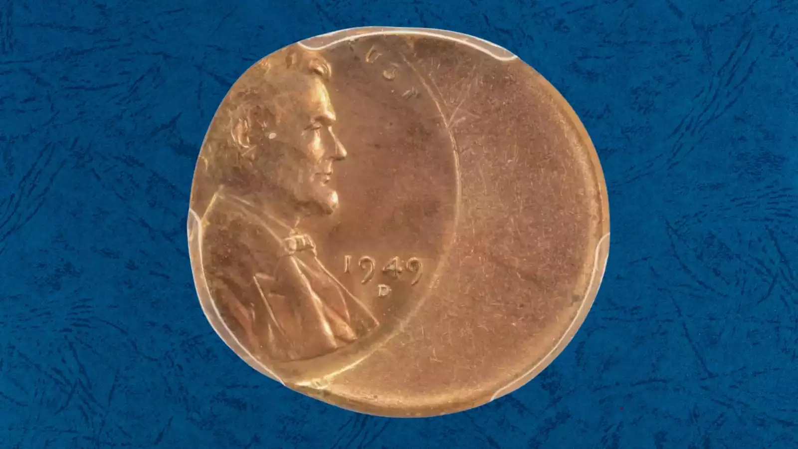 1949 wheat penny off-center strike showing Lincoln portrait shifted with blank planchet area visible