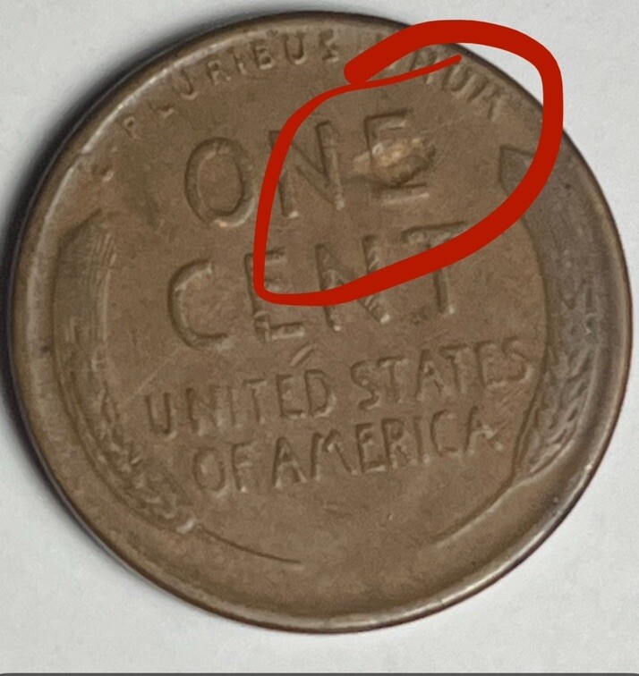 1949 wheat penny lamination error showing peeling or flaking bronze metal on coin surface